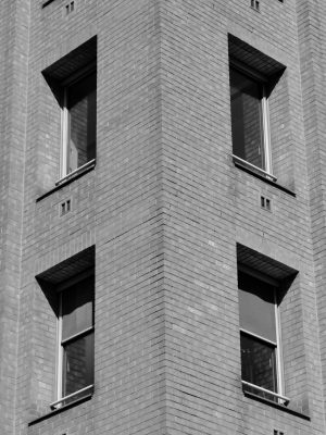 Windows shot from a corner giving a symetrical picture. Black and white.